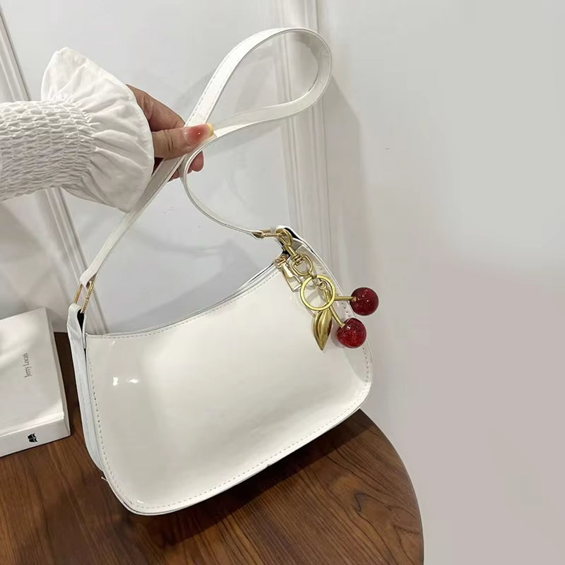 Women's PU Leather Handbag Versatile Fashion Solid Color Cherry Pendant Shoulder Bag